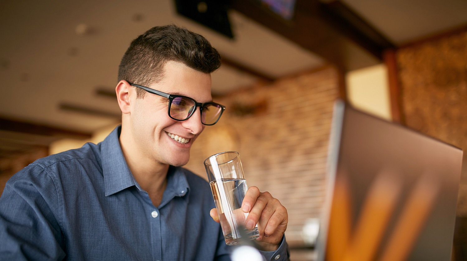 Feature | smiling man holding a glass of water | Reasons To Love Tyent Water Ionizers, Part 10: Tyent Alkaline Water Top Health Benefits At A Glance