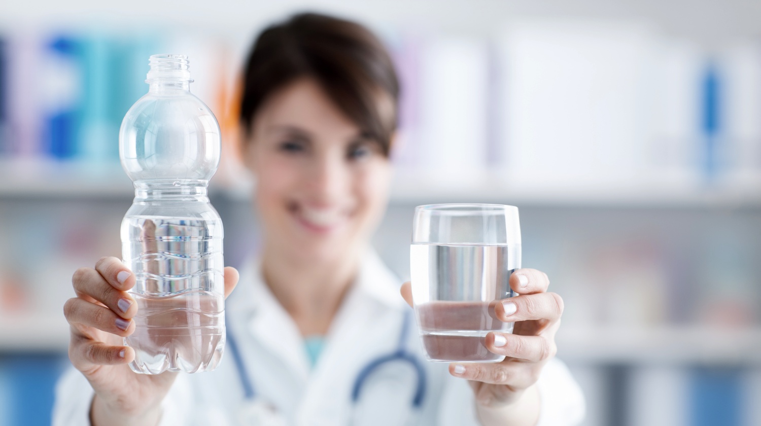 Feature | Smiling female doctor holding water | Reasons To Love Tyent Water Ionizers, Part 7: Doctors, Wellness Centers, And Tyent Water