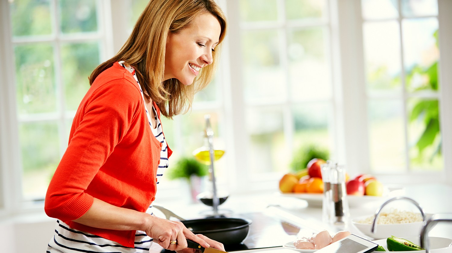 Feature | Woman preparing a dish | Kitchen Hacks Using Alkaline Water